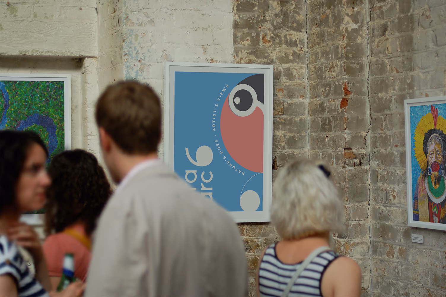 Visitors in a gallery with an AraArc 6 macaw poster on the wall.