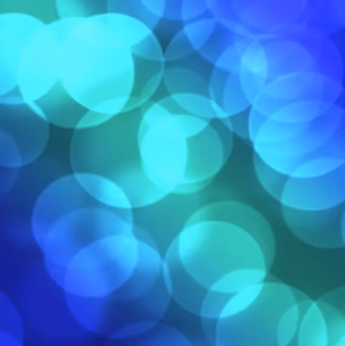 Abstract blue and teal bokeh background representing innovation and visual metaphor for highlighting new Bee platform features.