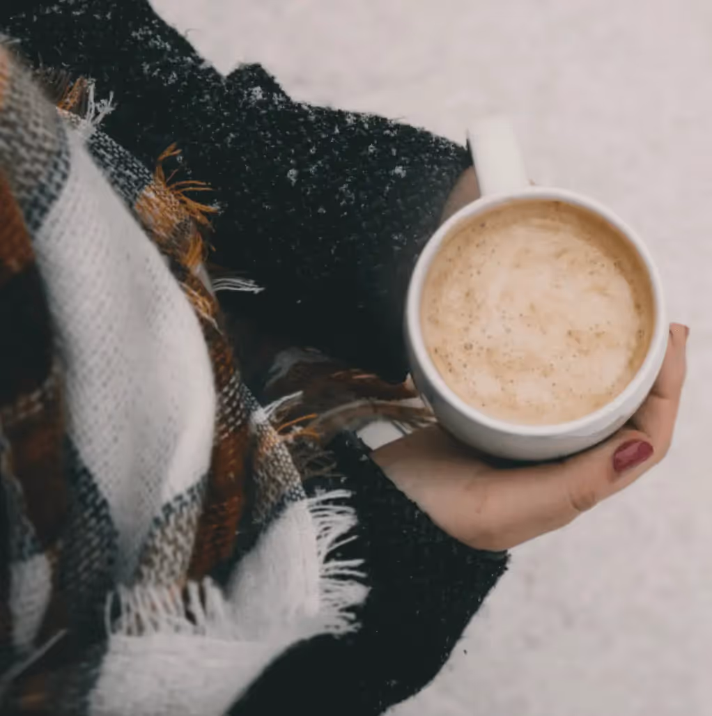A cozy cup of hot chocolate with marshmallows, representing warmth and comfort for winter-themed email campaigns.