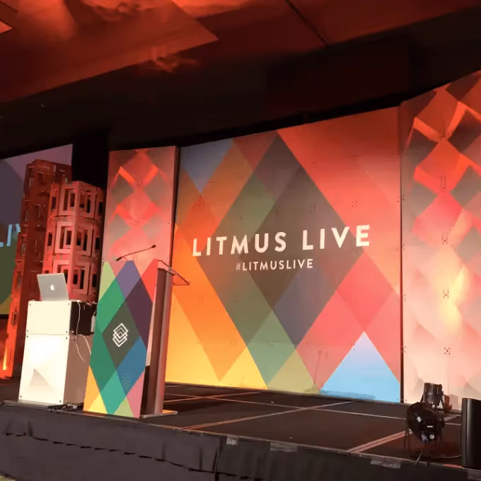Litmus Live Boston 2017 stage setup with colorful geometric backdrop and podium, highlighting best email design tips from the event.