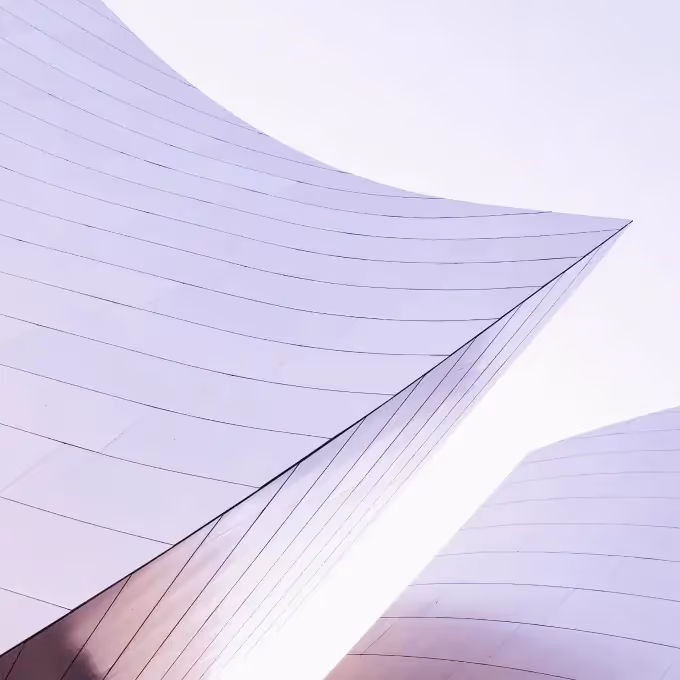 Abstract view of modern curved architecture with clean lines, used to illustrate tutorial on setting up a BEE Pro agency account.