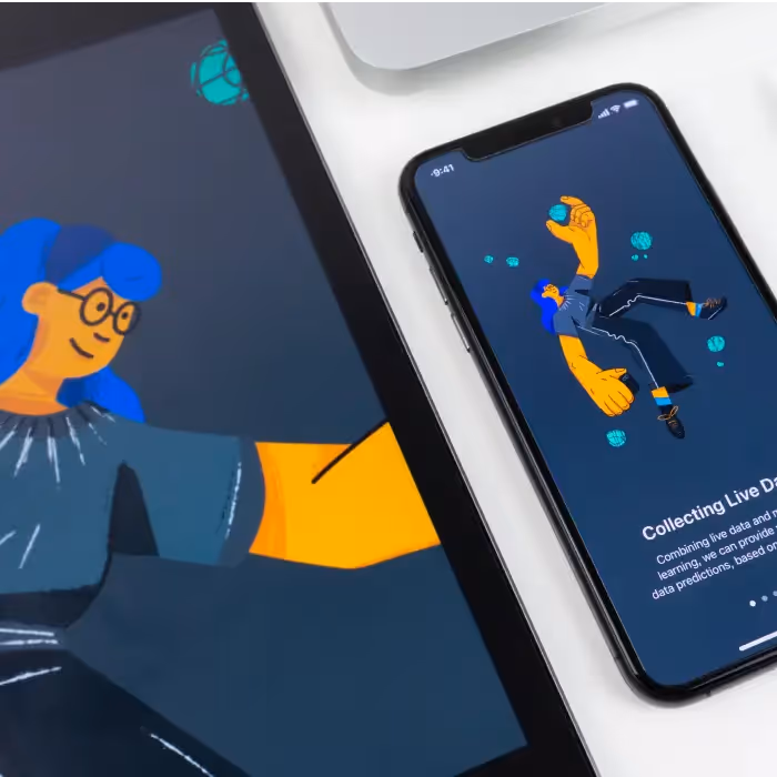 Illustration workspace: Tablet showing a blue-haired illustration next to an iPhone with a floating character design and a stylus on a white desk