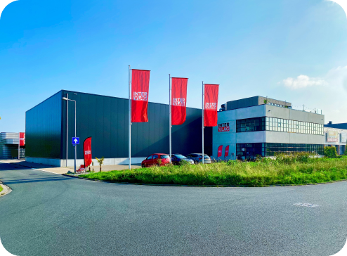 Intervlag logo, Intervlag is an HelloPrint partner, the picture is the outside of the company where you can see the wharehouse and their building