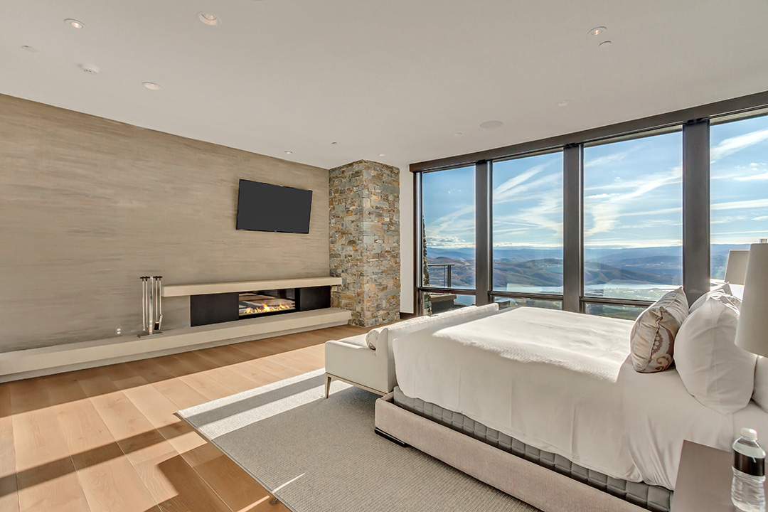 Exterior side view of 6 Bedroom House on a snowy hill.