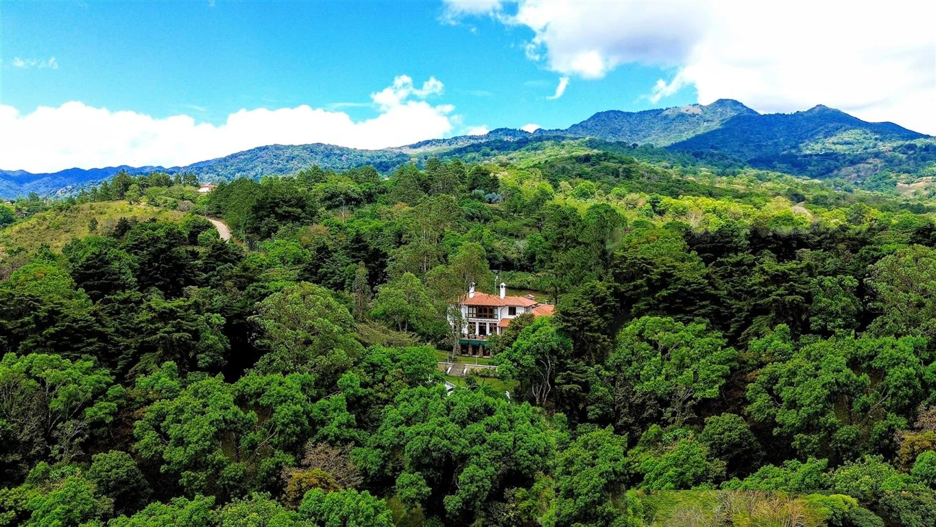 Aerial view of Serenity Vista nestled on a private forested hillside in Boquete, Panama.