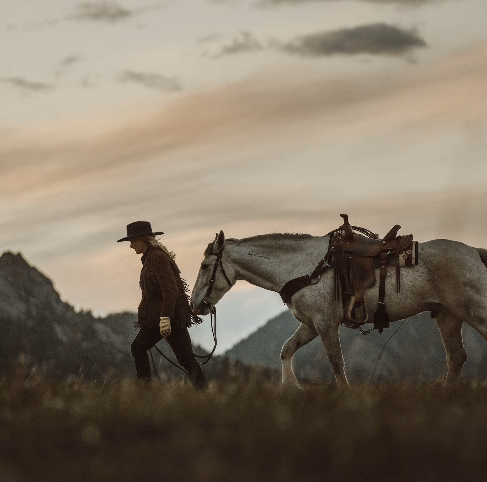 A picture of a women and a horse.