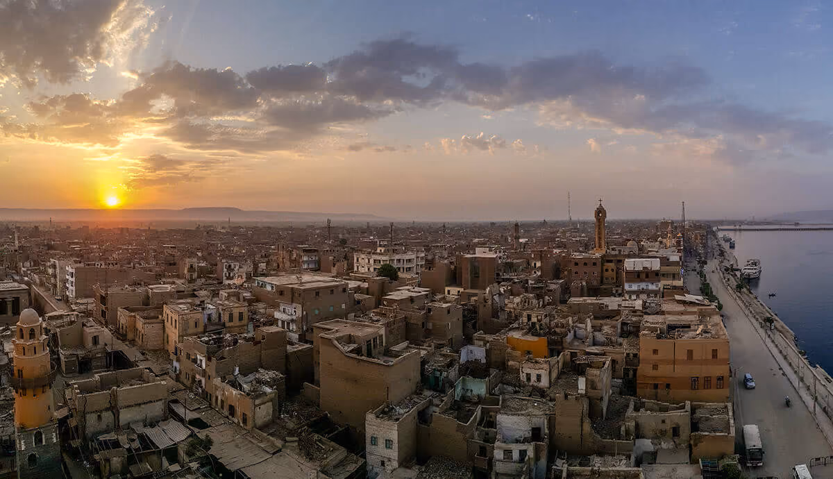 Buildings infront of the Nile during the sunset