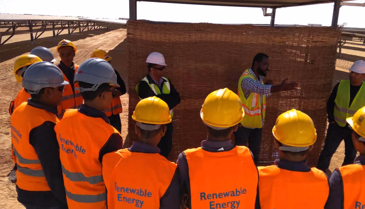Workers taking a session in the field