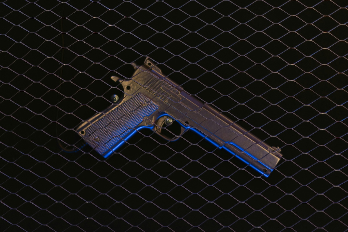 Pistol on a Black Surface
