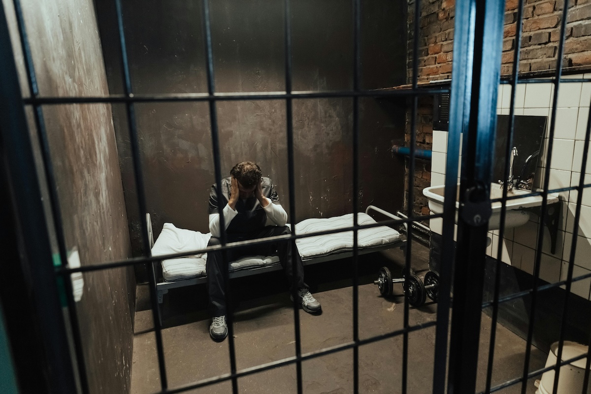 Prisoner Sitting in Cell