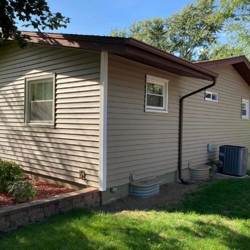 Completed siding and gutter project by Northrup's Roofing & Restoration in Milwaukee, Wisconsin.