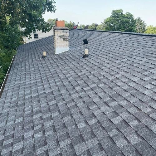 Completed asphalt roofing project by Northrup's Roofing & Restoration in Milwaukee, Wisconsin.