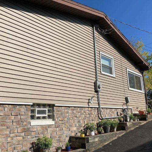 Completed siding project by Northrup's Roofing & Restoration in Milwaukee, Wisconsin.