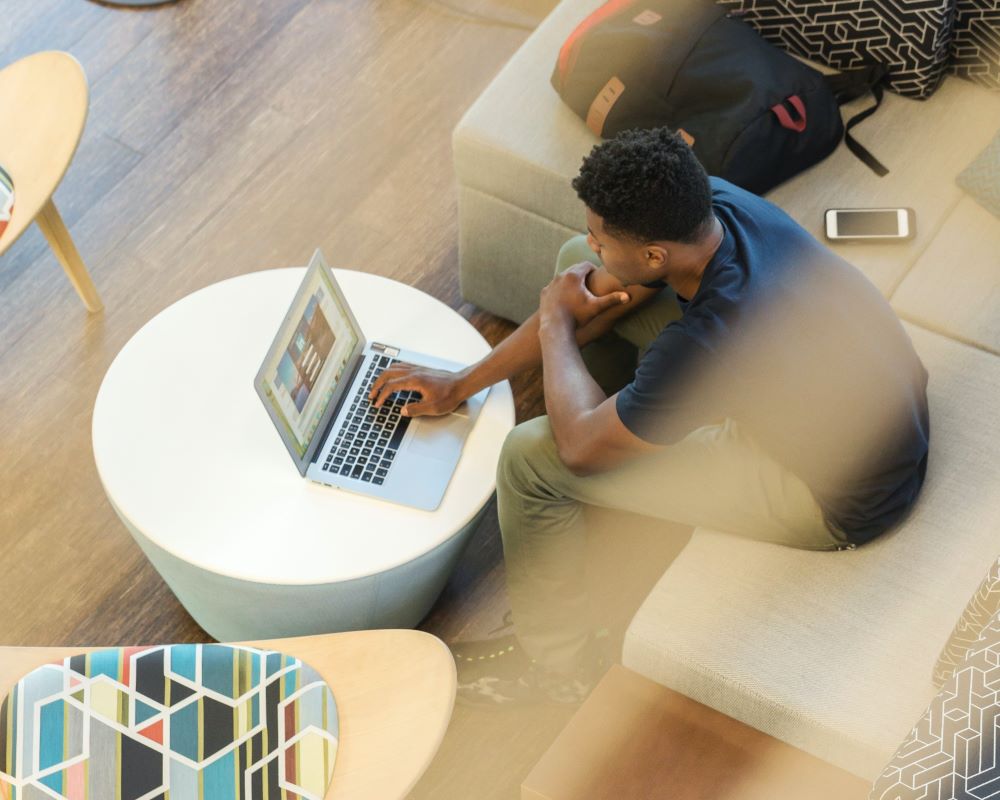 Young black male working on his laptop