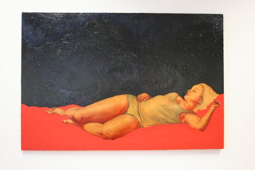 child laying in coloured artwork