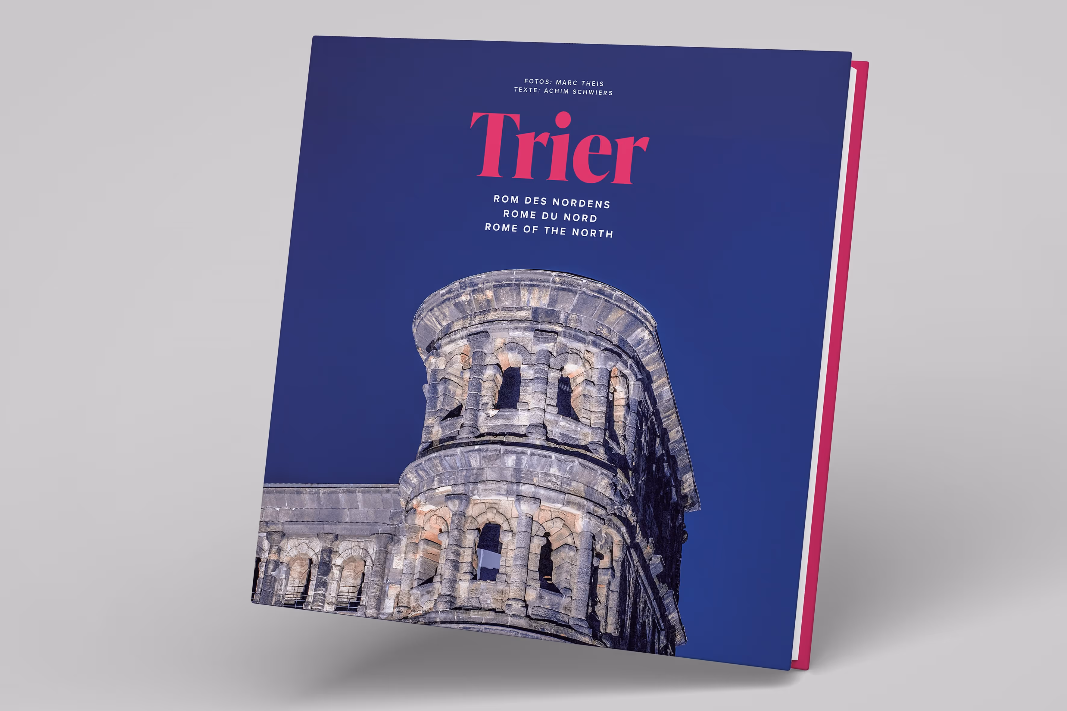 Book cover featuring a photo of ancient stone Roman architecture against a deep blue sky with the title 'Trier' and subtitle 'Rome of the North' in German, French, and English.