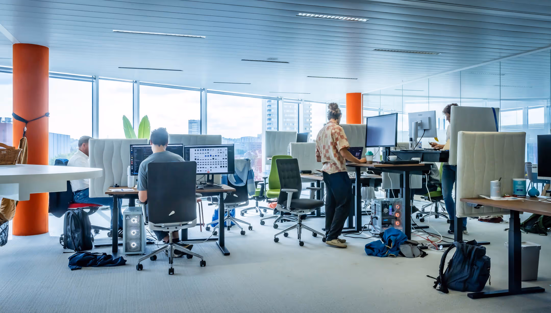 The relu-office with employees working at their desk.