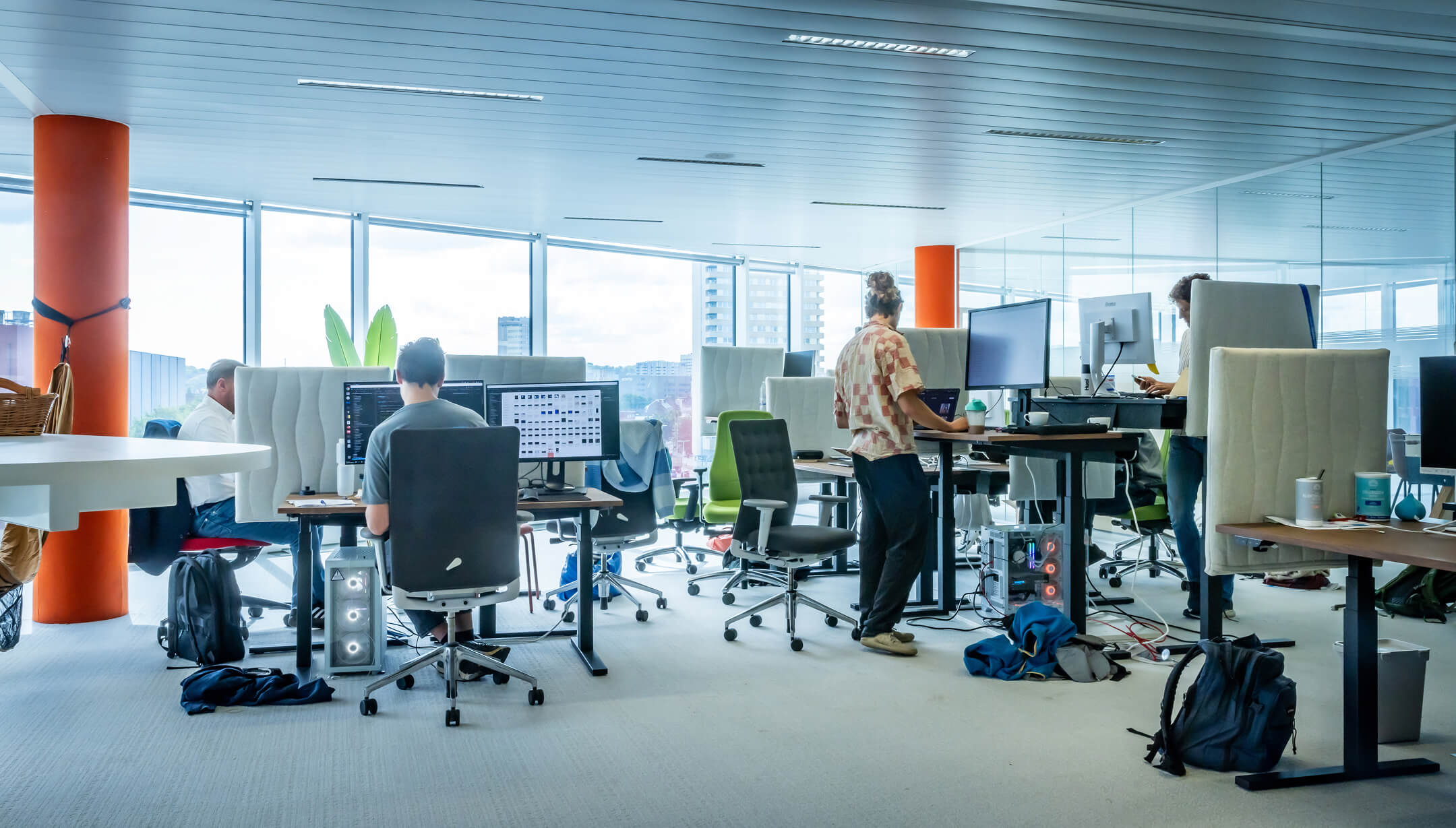 The relu-office with employees working at their desk.