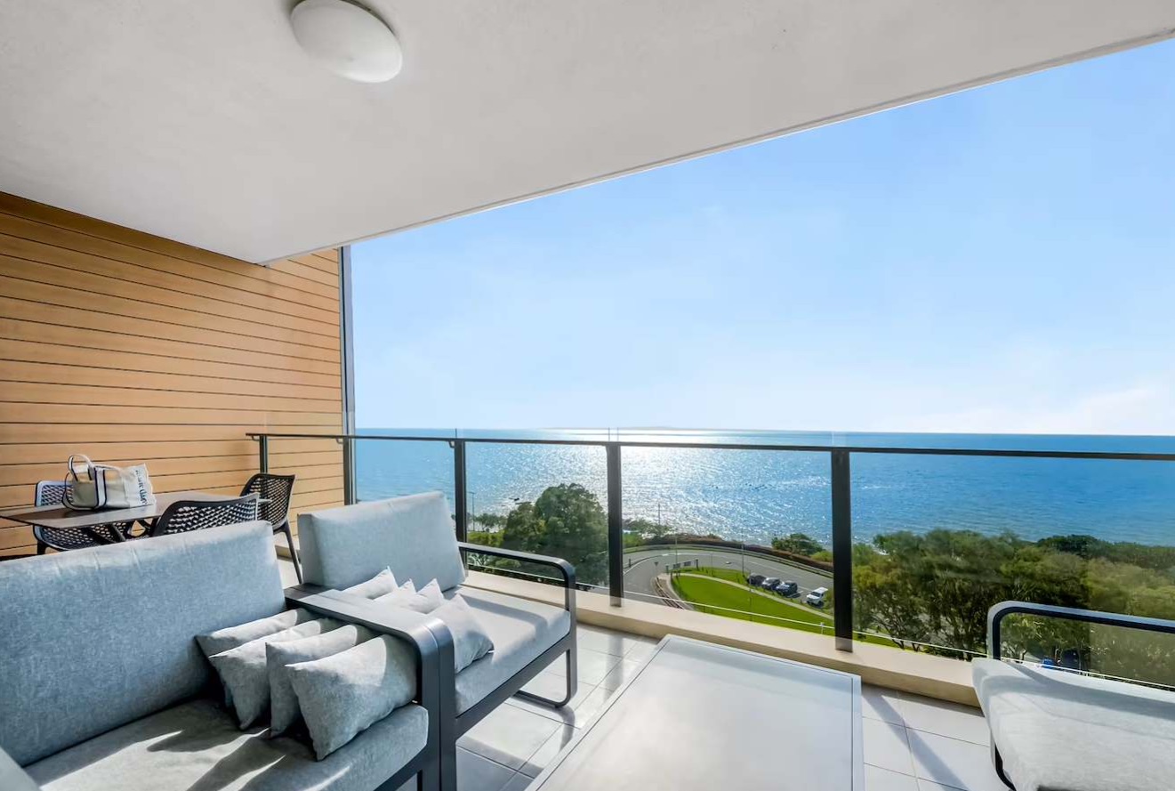 Balcony lounge seating with uninterrupted views across Moreton Bay