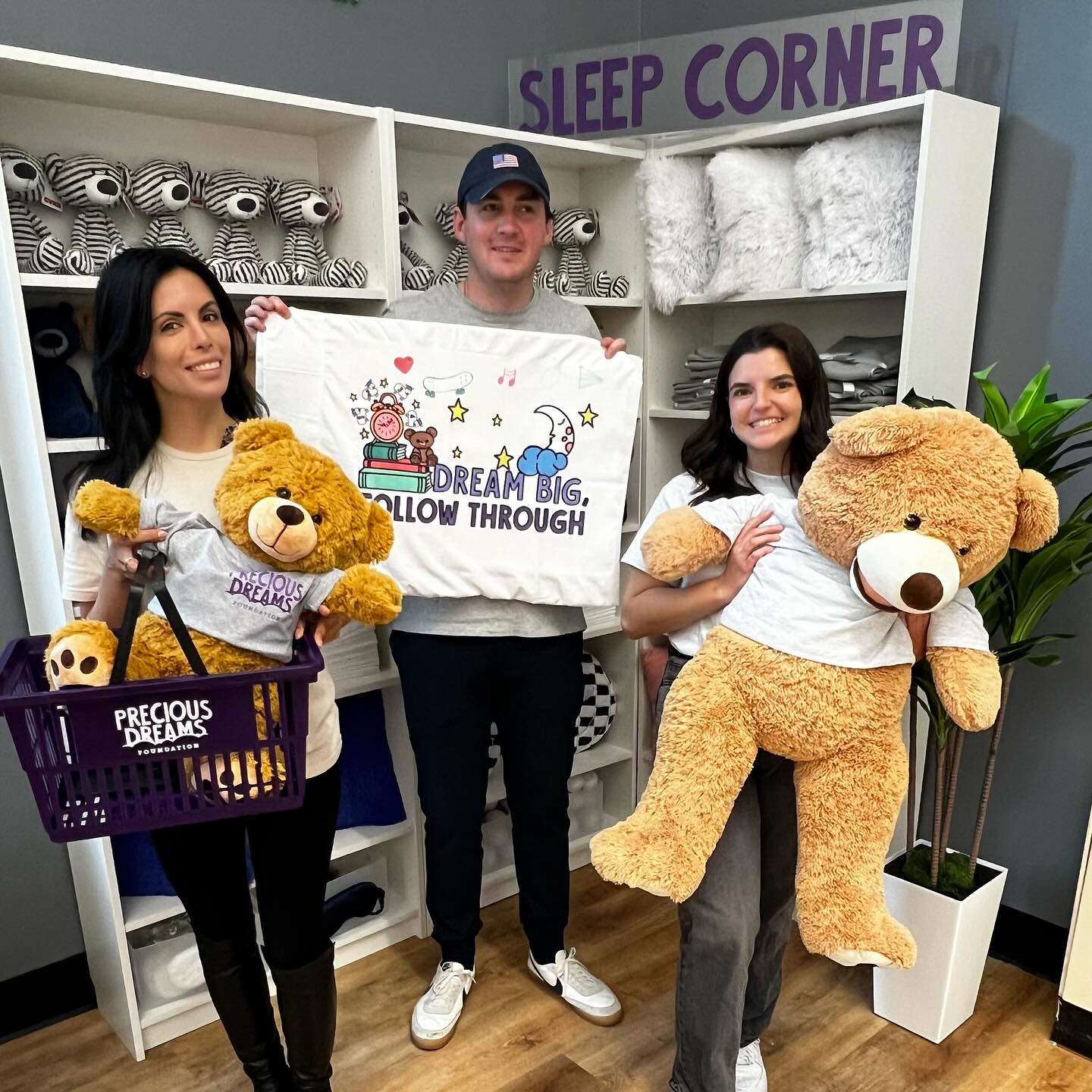photo of a volunteer with child coloring in their comfort item