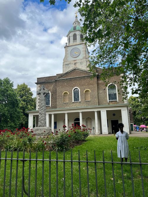 photo of a church next to trees