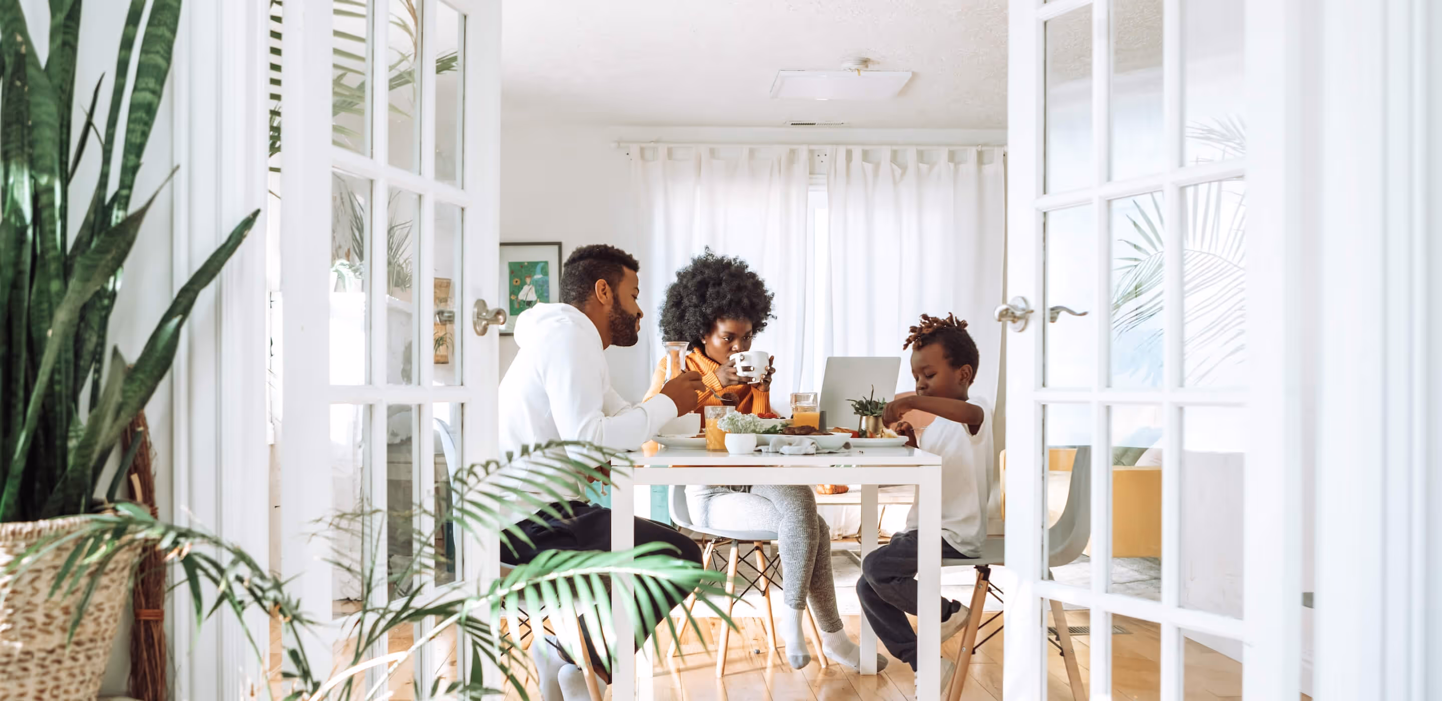 Family at kitchen table enjoying a meal in their new home in Tullahoma, TN