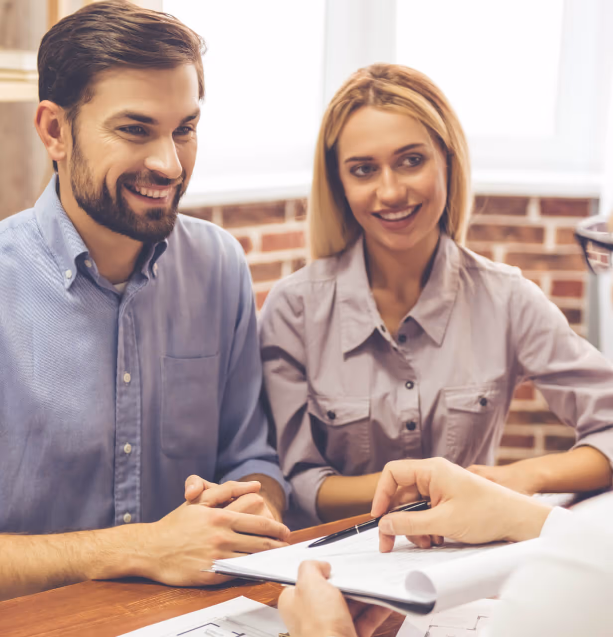 Happy couple signing on their new home in Tennessee