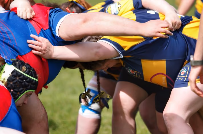 a group of people playing rugby
