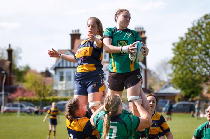 a group of women playing rugby