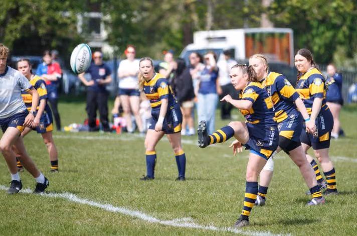 a group of women playing rugby