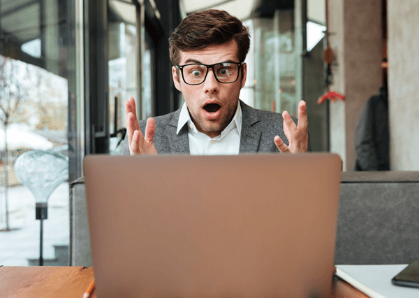 man in shock when he looks at his webdesign