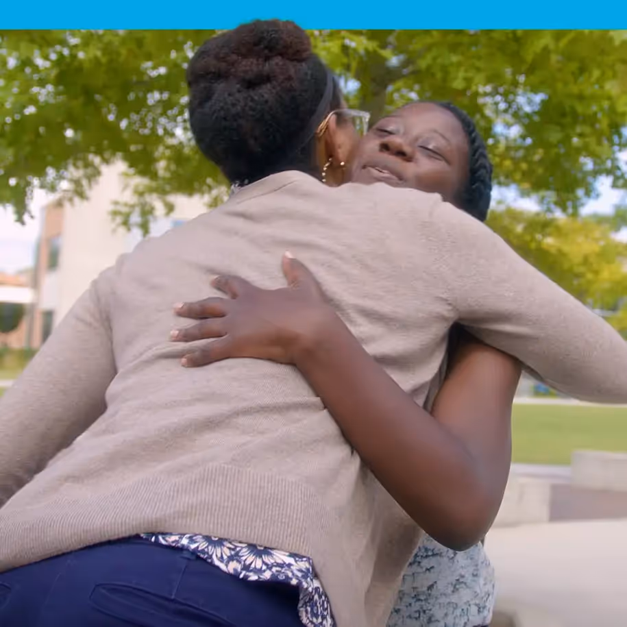 Students hugging | InsideTrack