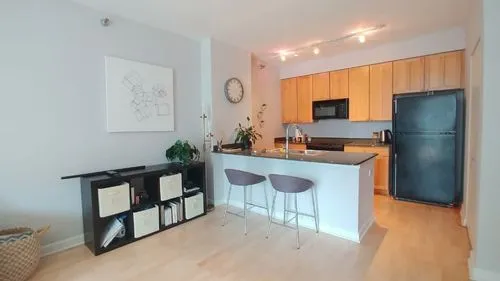 A photograph of an interior kitchen