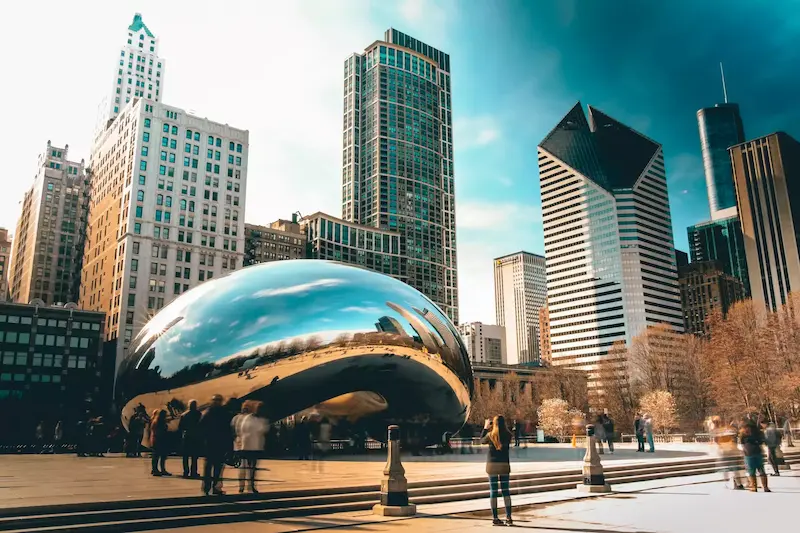 A photograph that shows the city of Chicago, specifically the famous Bean