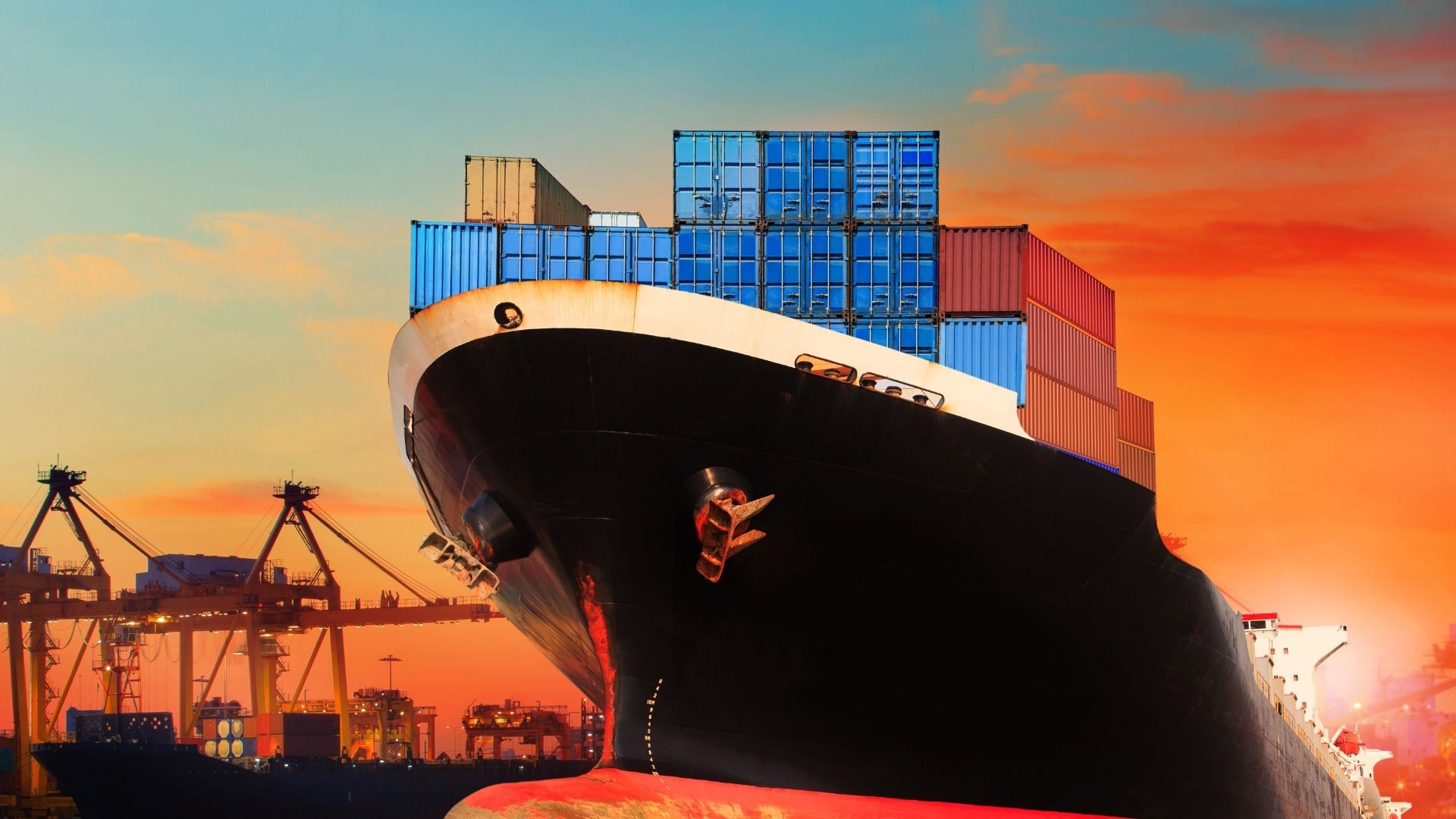 a container ship[ docked at a terminal showing outlook for 2026