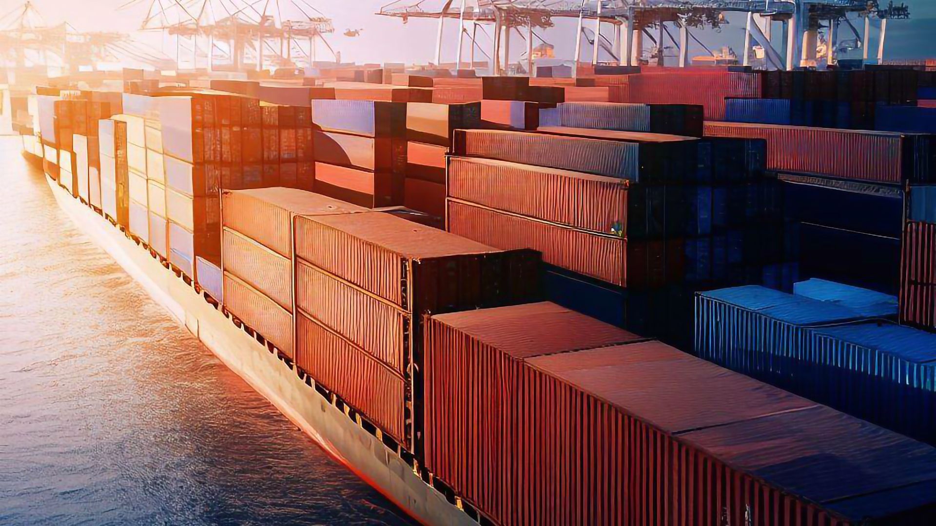 a close up view of a container ship with stacked container at dwell at a port november 2025