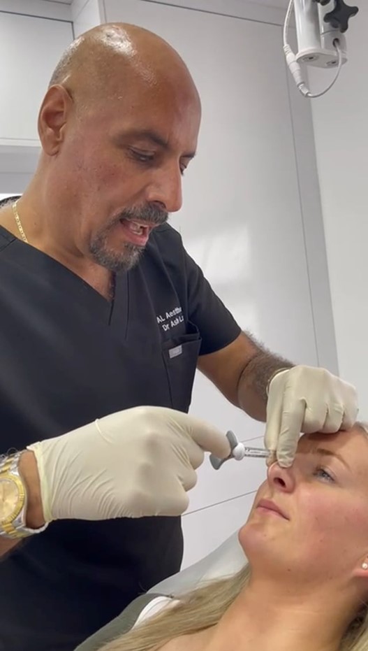 Patient discussing cosmetic treatment goals such as dermal fillers and anti-wrinkle injections with practitioner