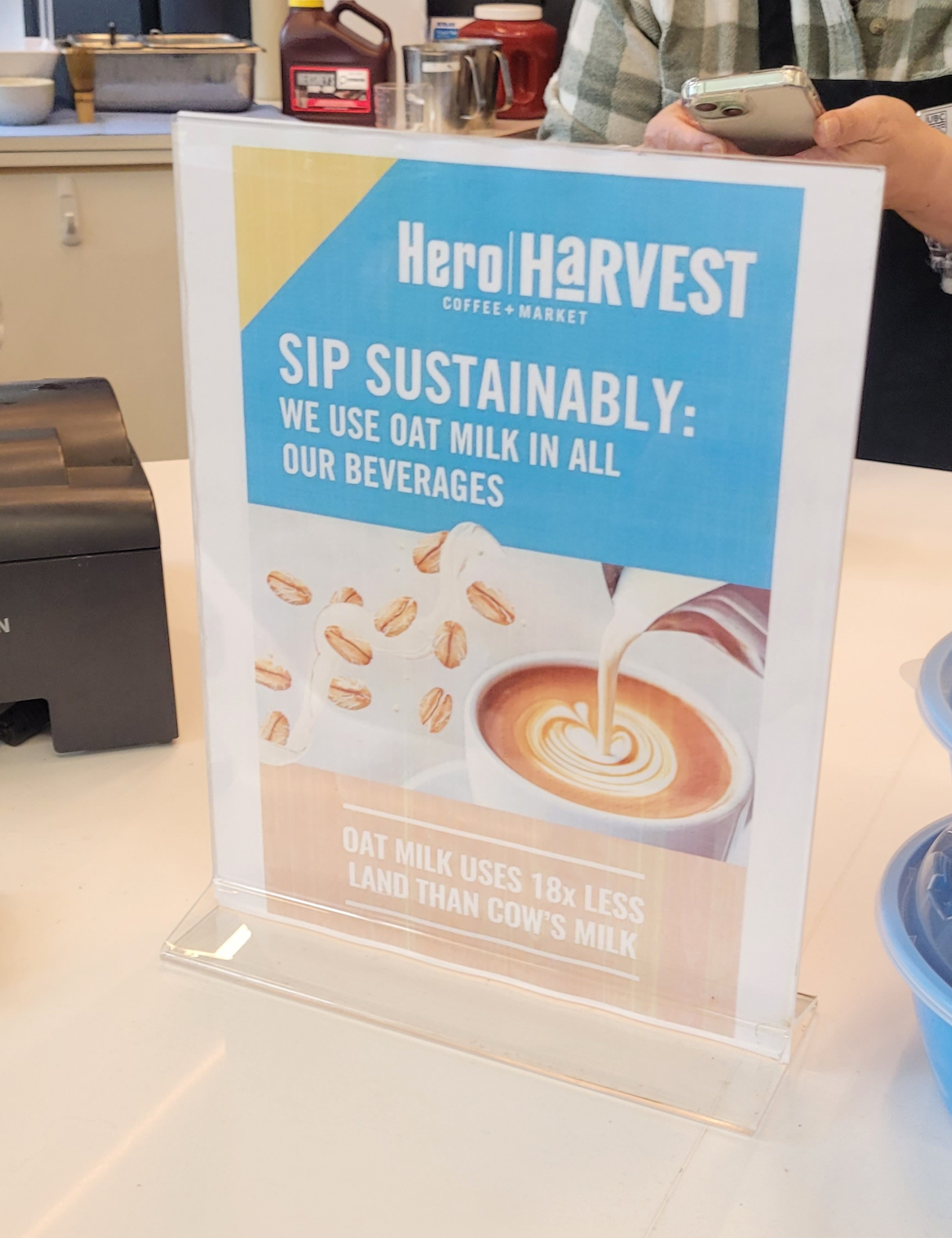 UBC's Hero Harvest Cafe displaying oat milk default banner on counter