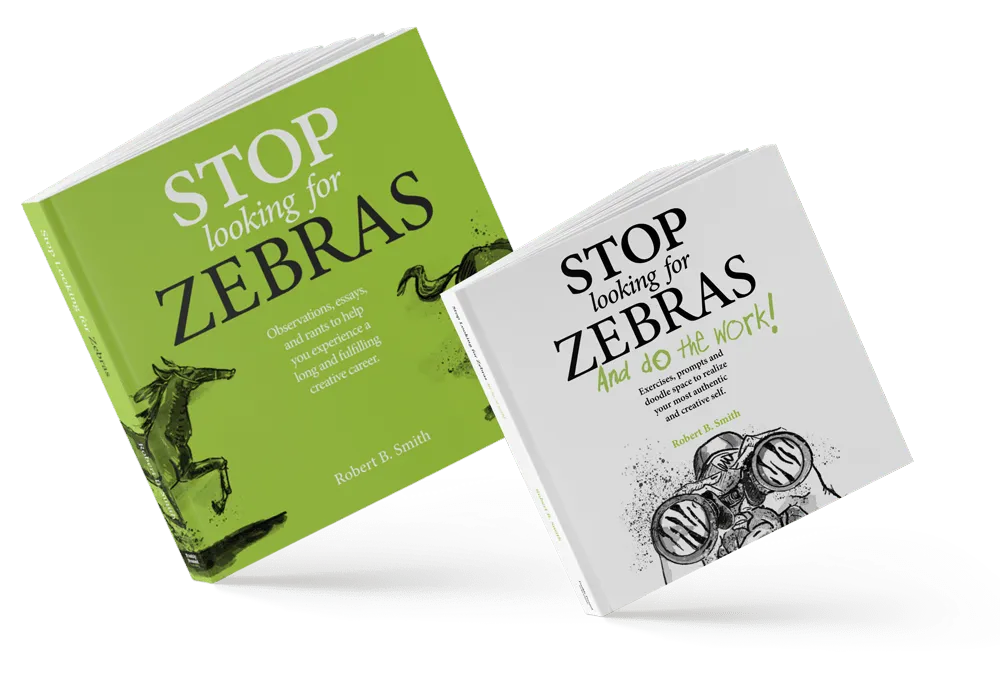 A black and white photo of Robert Smith writing notes on a wooden bench.