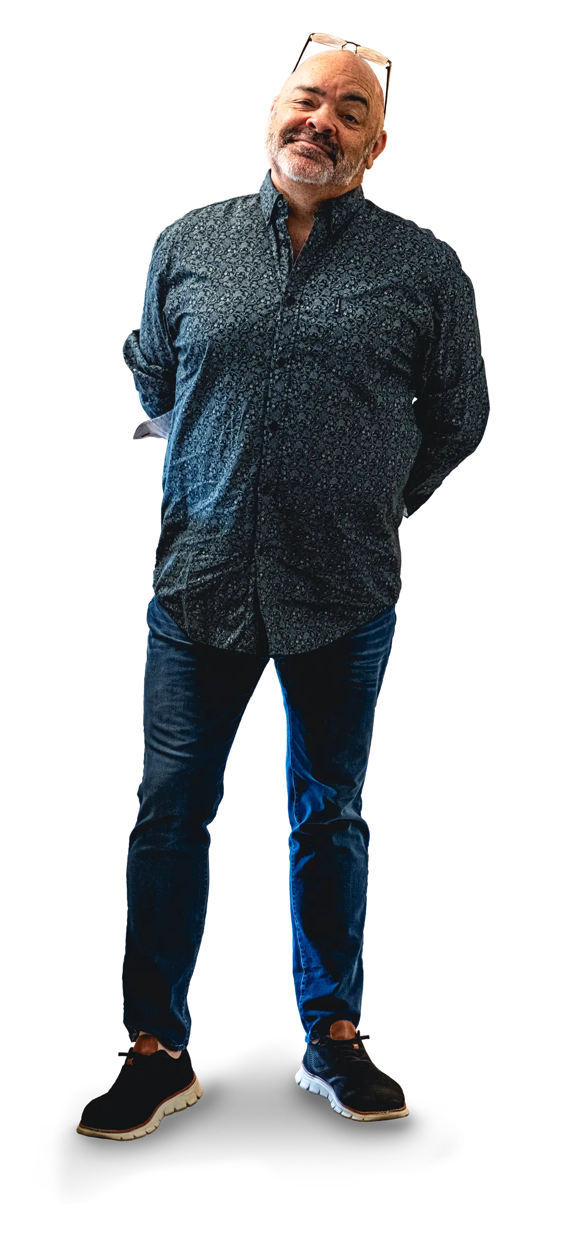 Rob standing with arms behind back.