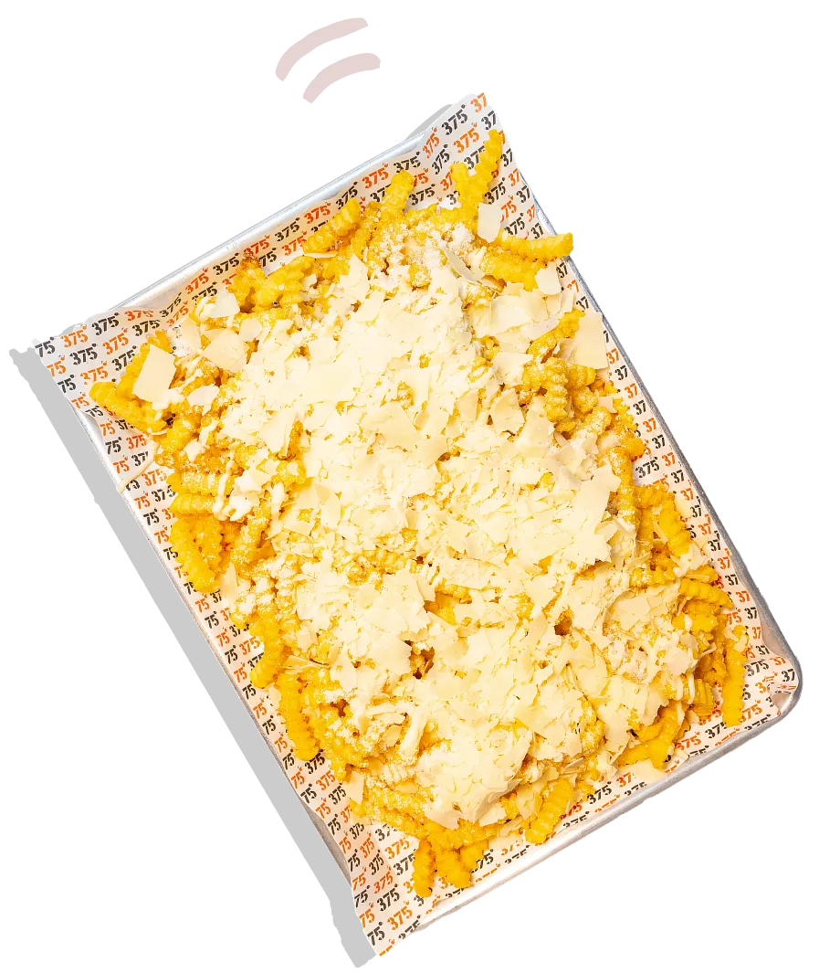 A square dish of food with cheese on top.