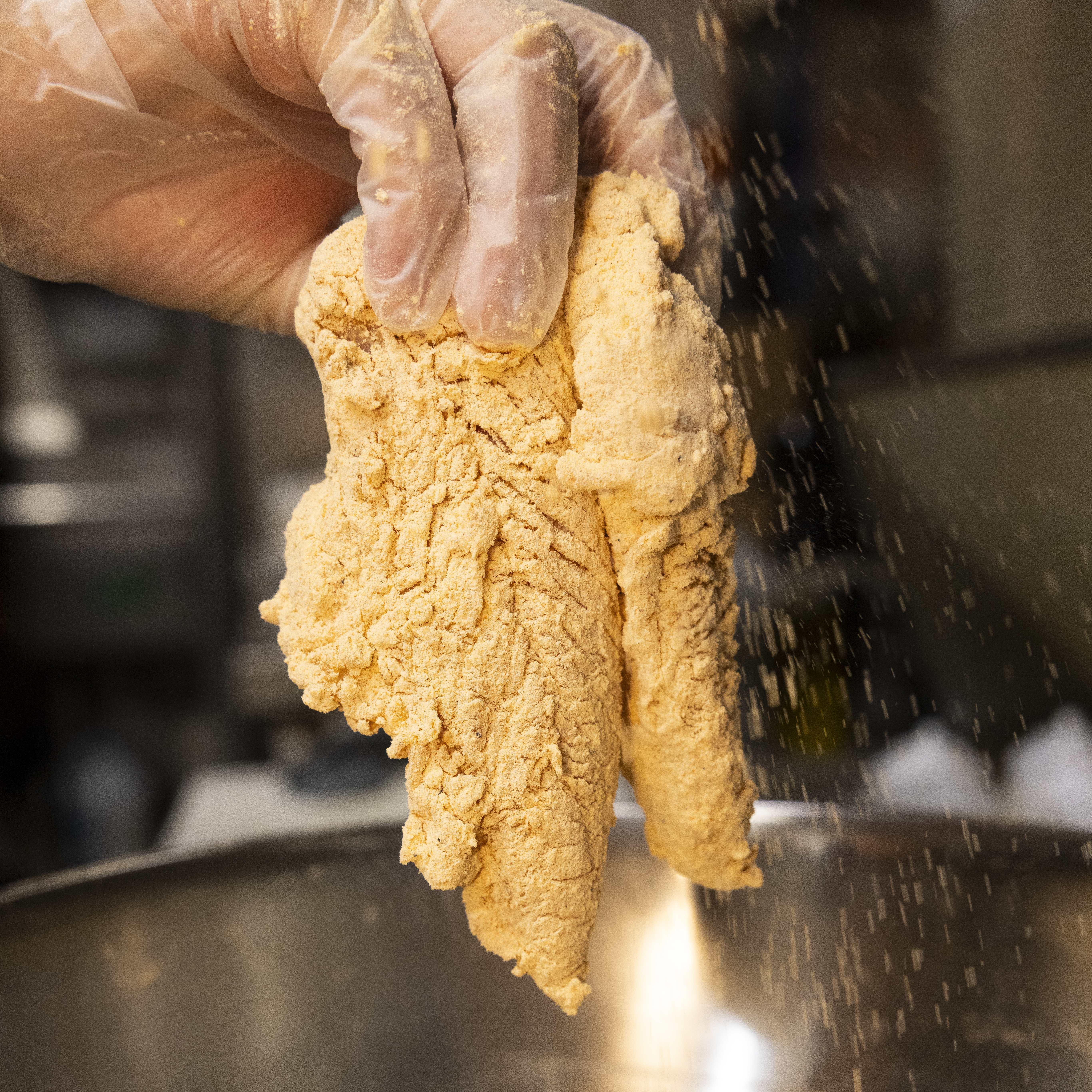 Hand Breading a Chicken Tender