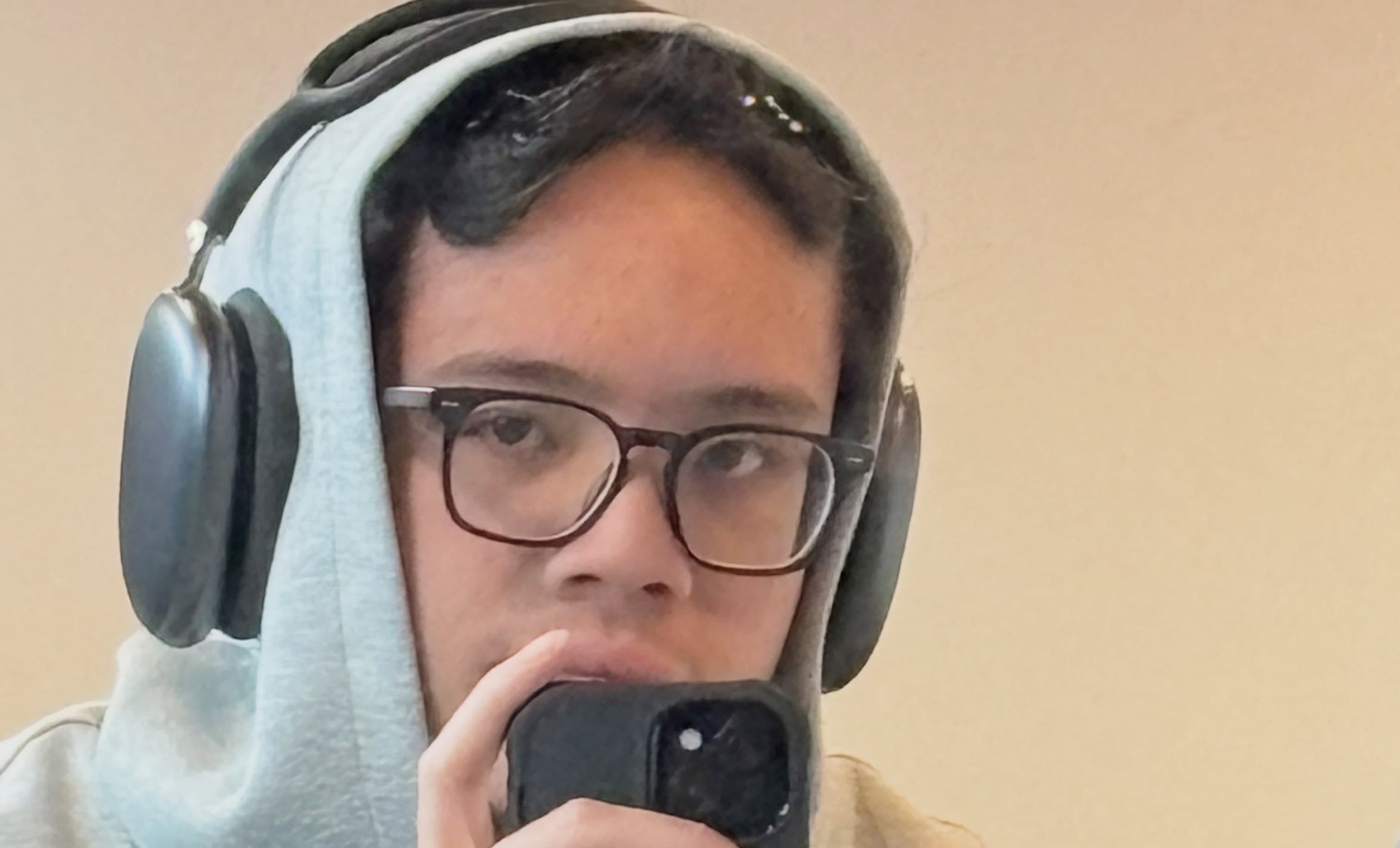 Santiago taking a mirror selfie at the gym trying not to look like he did too much. (He failed)