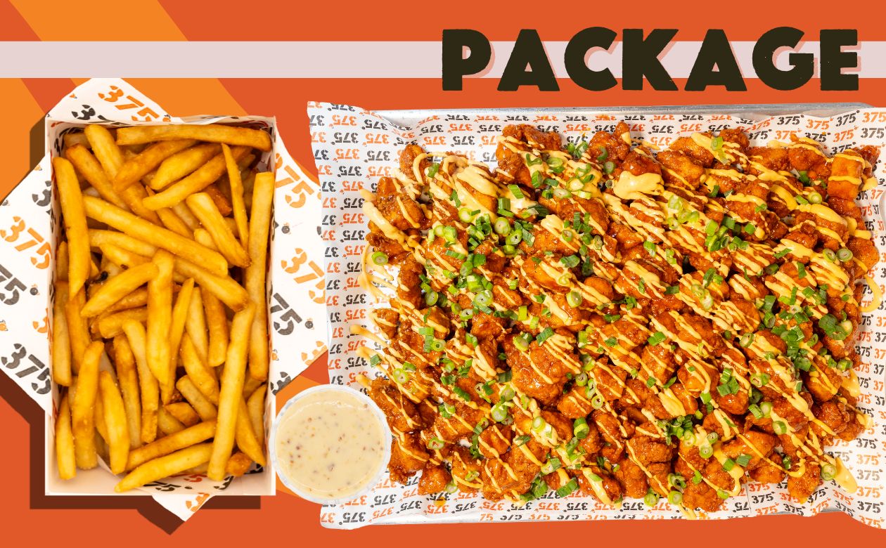 a tray of food with a lemon on the side