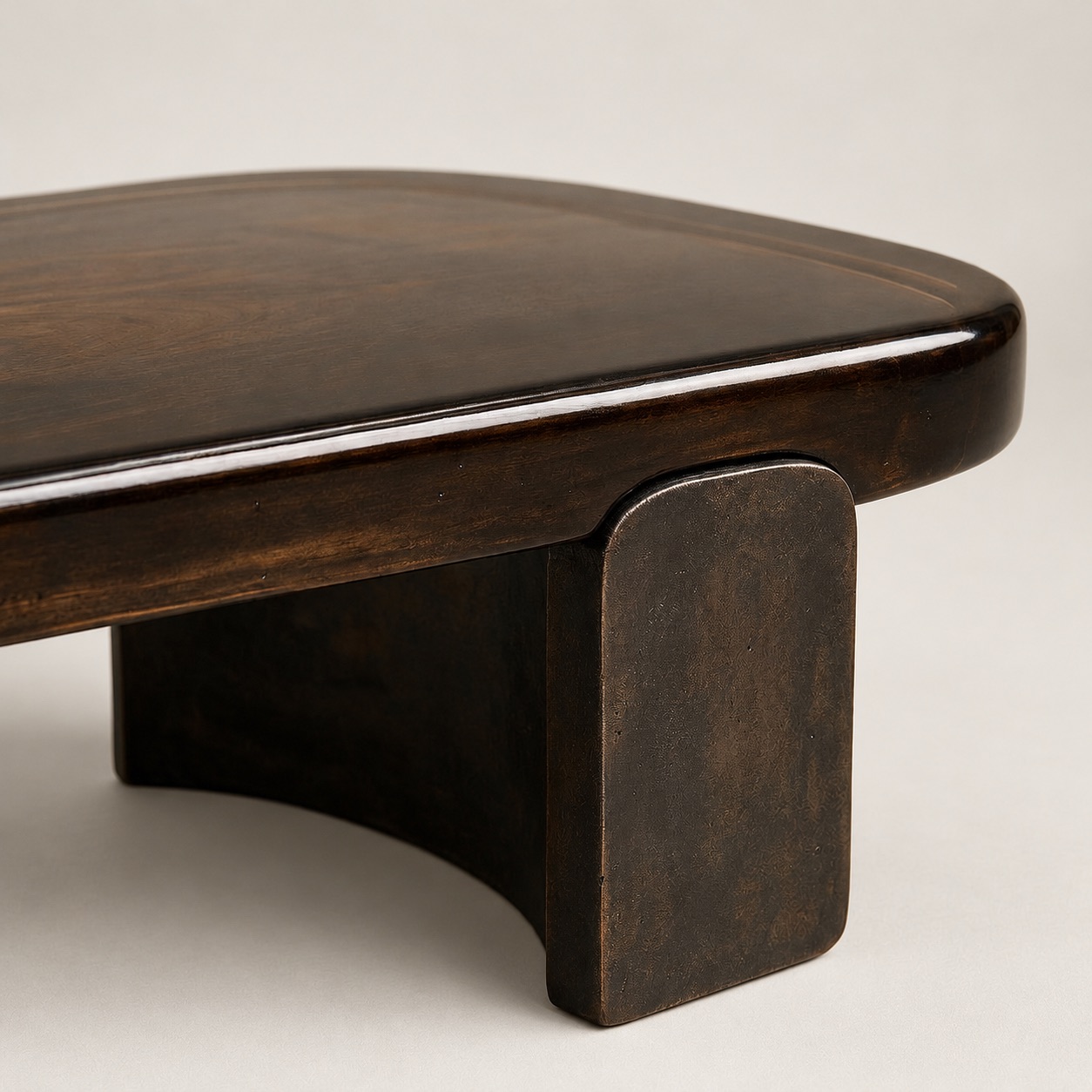 Nova coffee table by Jordan Carlyle, close-up detail of cast glass top edge and bronze base - Carlyle Collective