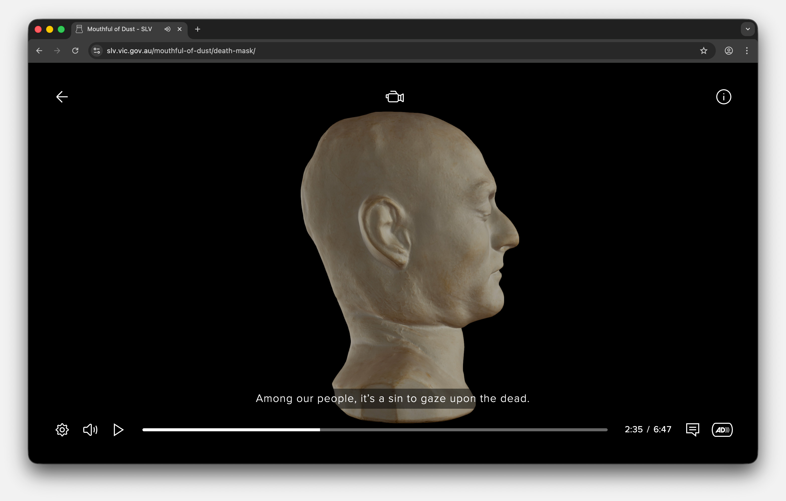 Side view of a pale, sculpted death mask against a black background with subtitle: 'Among our people, it’s a sin to gaze upon the dead.'