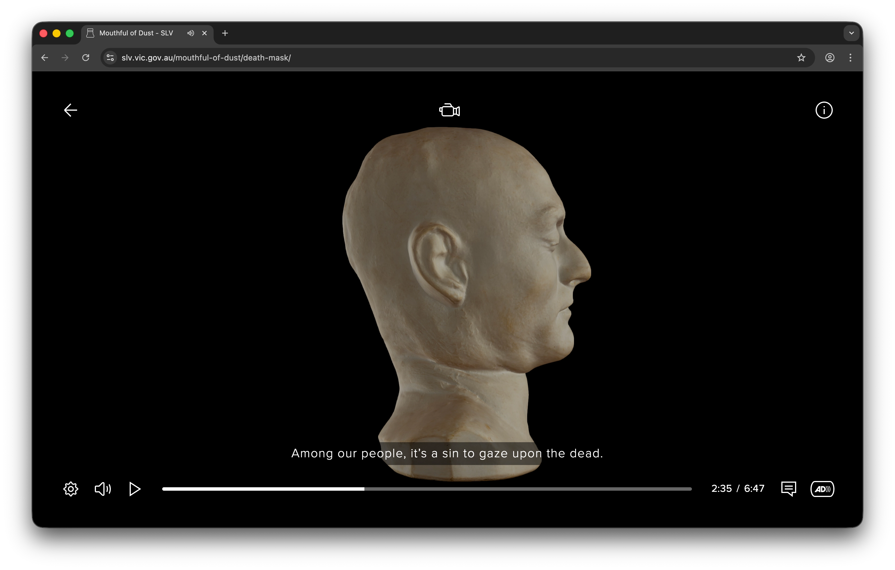 Side view of a pale, sculpted death mask against a black background with subtitle: 'Among our people, it’s a sin to gaze upon the dead.'