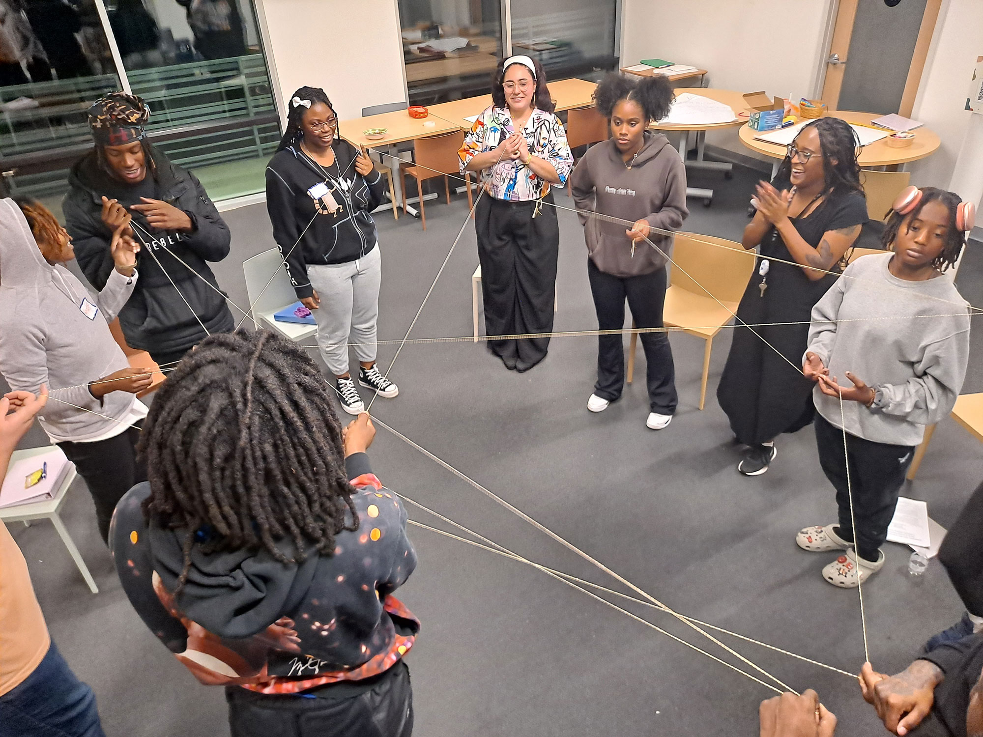 Group of people playing with the cord.