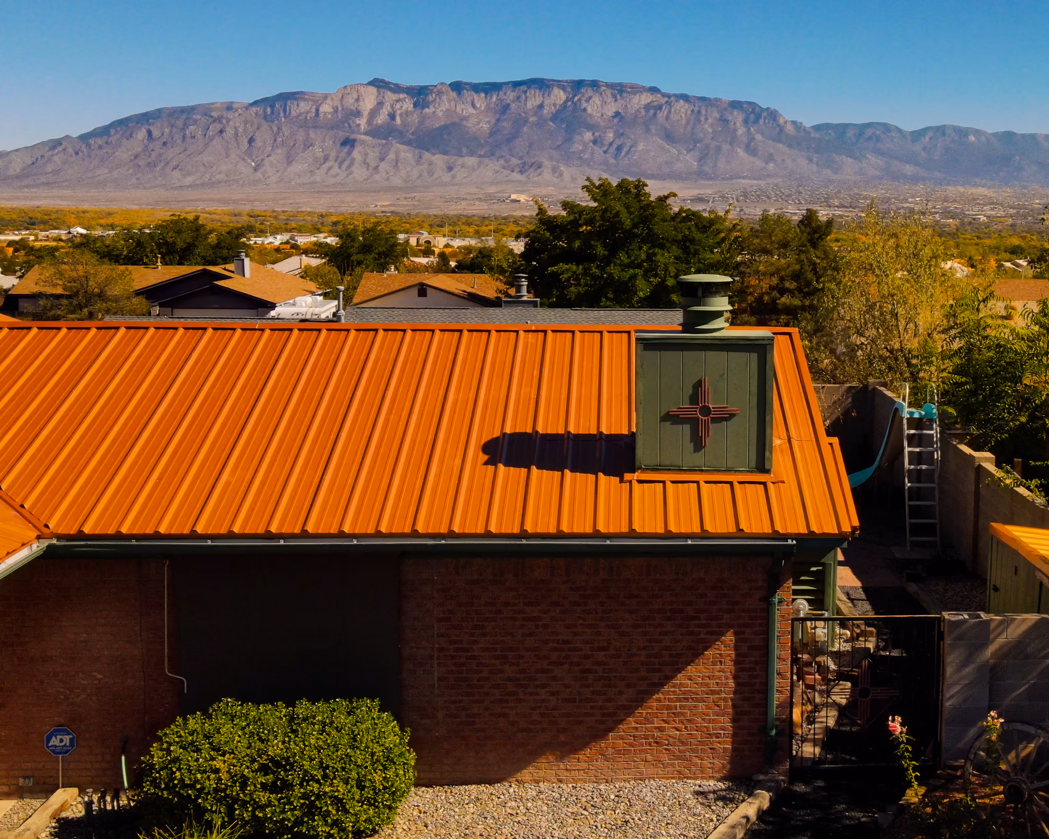 metal roof replacement with Sandia Mountains in the background