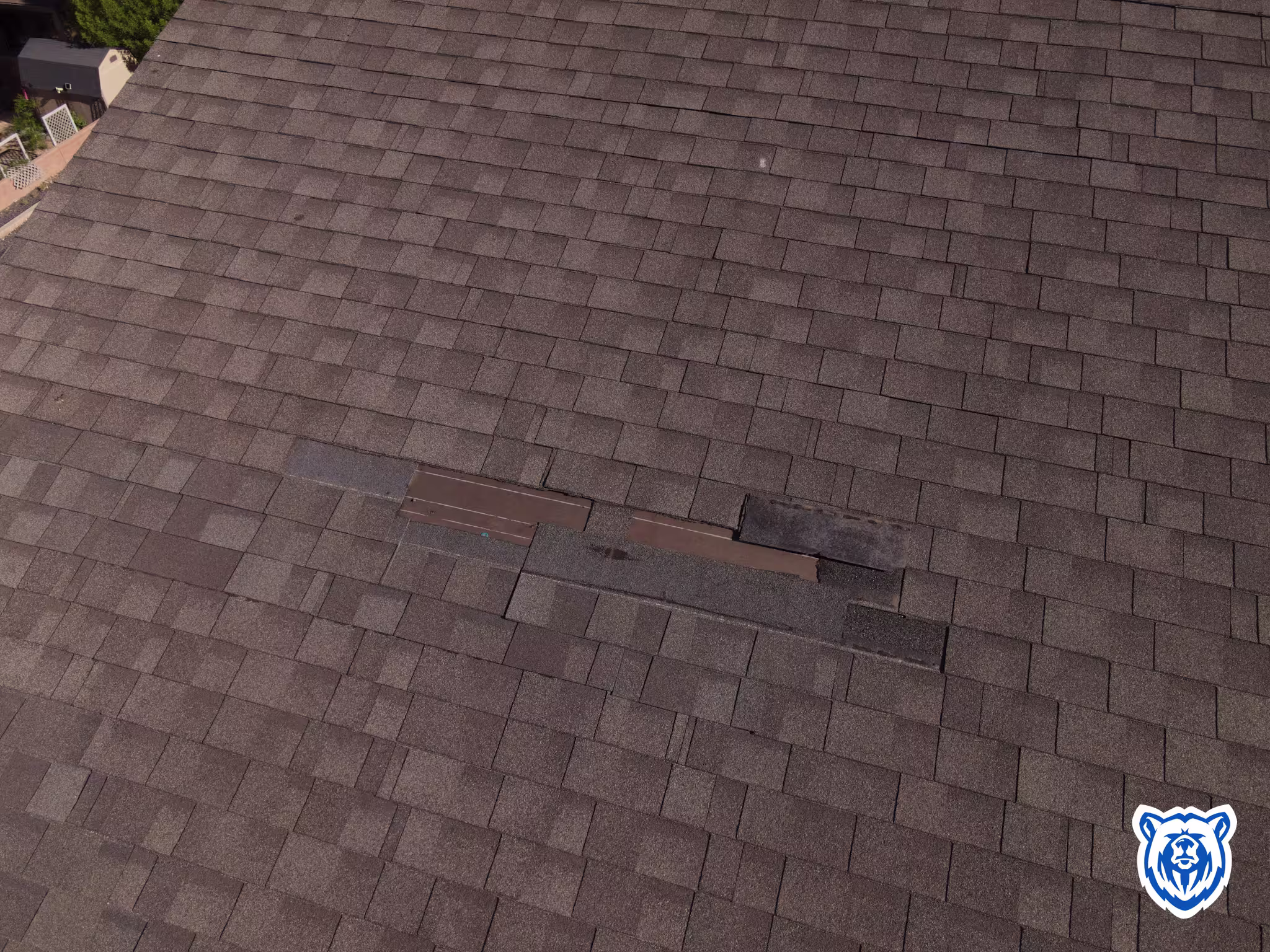 WInd damage shingles prior to repair
